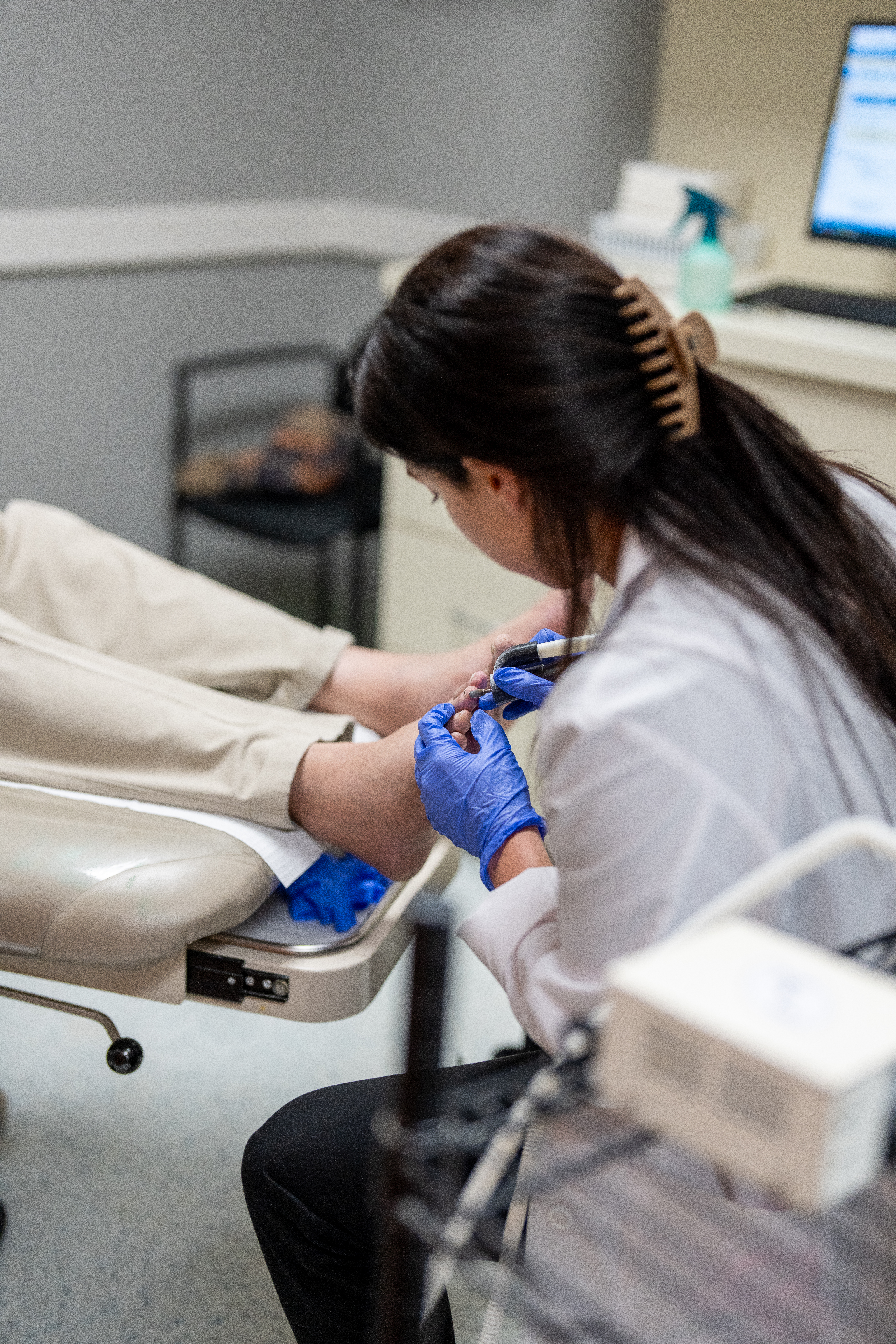 Dr. Michelle DeJesus treating patient with Skin, Nail & Systemic Issues